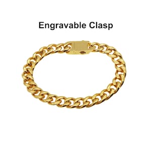 May include: A gold chain bracelet with an engravable clasp. The chain is a curb style.