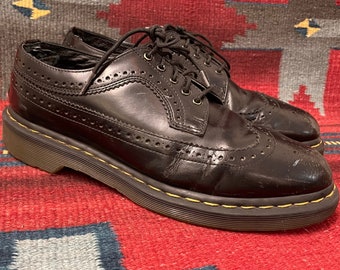 Broken-in and distressed Dr. Martens Smooth Black Leather Brogue Wingtip Oxfords US MENS size 10 (UK size 9)