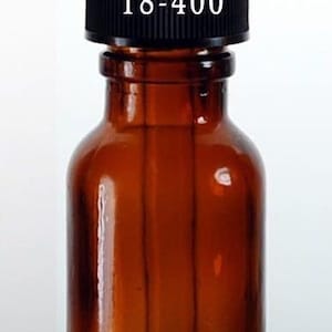 May include: A 15 ml amber glass bottle with a black dropper top. The bottle has a black cap with the number 18-400 printed on it.