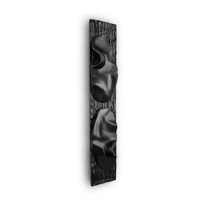 May include: Black wooden wall decor with two black, organic-shaped, 3D wall hooks.