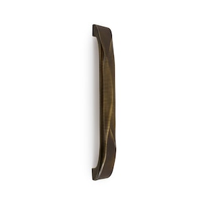 May include: A brushed brass cabinet pull with a unique, twisted design. The pull has a smooth, rounded finish and a slightly curved shape.
