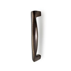 May include: A bronze cabinet pull with a curved, ergonomic design. The handle has a smooth, polished finish and rectangular mounting bases. The hardware is designed for easy installation and adds elegance to any cabinet or drawer. The length is approximately 15 cm.