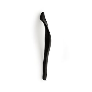May include: A black, abstract, modern door handle with a unique, curved design.