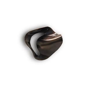 May include: A dark, abstract sculpture with a flowing, organic shape. The object is a deep, iridescent brown with highlights, and a curved, open space in the centre. The form is smooth and reflective, suggesting a polished surface.