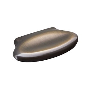 May include: A brushed antique brass cabinet pull with a rounded, oval shape.