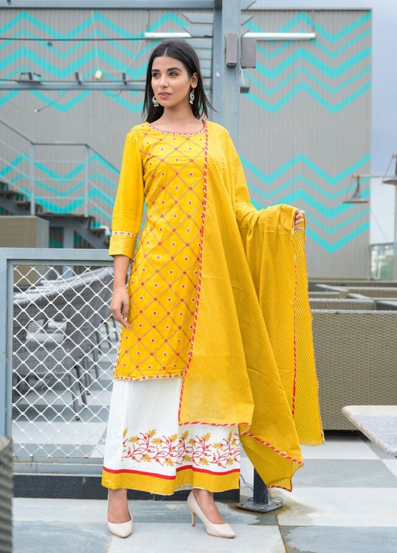 Yellow embroidered sequinned kurti with palazzo & dupatta - vidraa western  store - 4221342