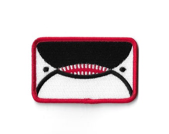 Flaga miasta Seattle z twarzą orki i wieloryba