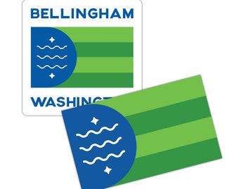 May include: Two stickers featuring the flag of Bellingham, Washington. The flag is blue, green, and white with a stylized wave design and stars. The top sticker has the text "BELLINGHAM" and "WASHINGTON" printed in blue. The bottom sticker is just the flag.