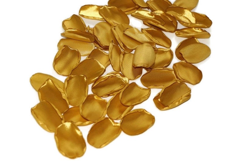 May include: A pile of gold satin rose petals, perfect for wedding decorations or special events.