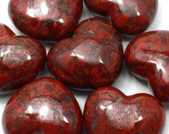 May include: Seven red heart-shaped stones with a marbled pattern. The stones are polished and have a glossy finish.
