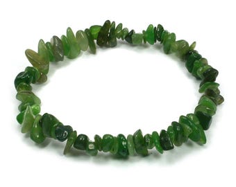 May include: A green jade chip bracelet made of small, irregular shaped stones. The bracelet is made of natural jade and is a beautiful and unique piece of jewelry.