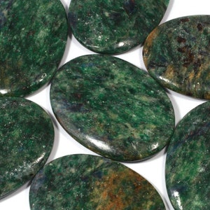 May include: Six smooth, oval-shaped green stones with a speckled pattern. The stones have a polished finish and are a deep green color with hints of brown and blue.