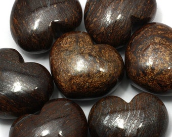 May include: Seven heart-shaped polished stones with a brown and silver marbled pattern.