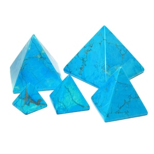 May include: Five turquoise blue gemstone pyramids of varying sizes. The pyramids are smooth and have a marbled pattern.