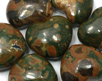 May include: Six heart-shaped polished stones with a green, brown, and red mottled pattern.