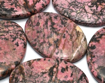 May include: Five smooth, oval-shaped polished stones with a pink and black marbled pattern.