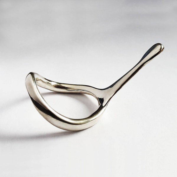 Silver cockring with stimulating extension.