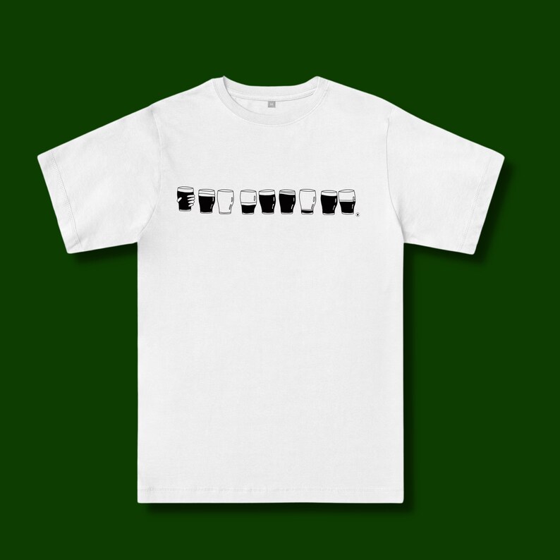 May include: White t-shirt with a black graphic of a row of pint glasses, some full and some empty.