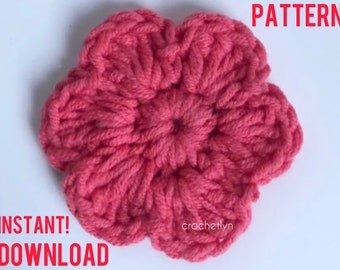 May include: A pink crocheted flower with a textured design. The image includes the text "PATTERN" and "INSTANT! DOWNLOAD".