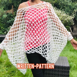May include: White crochet poncho with a honeycomb pattern. The poncho has a wide, open neckline and long sleeves. The model is wearing the poncho over a pink tank top.