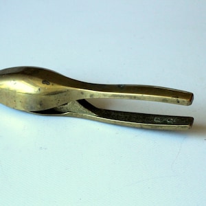 Sturdy, shapely nutcracker made of brass, marked, vintage, mid century, solid brass nut cracker