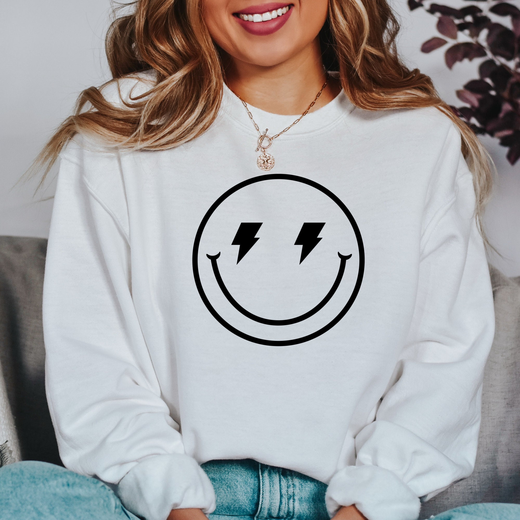 smiley face lightning bolt sweatshirt