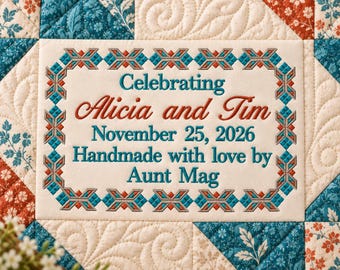 May include: A cream-colored fabric patch embroidered with teal and rust-colored geometric borders. The text reads: Celebrating Alicia and Tim, November 25, 2026, Handmade with love by Aunt Mag. The patch is sewn onto a quilted fabric background.