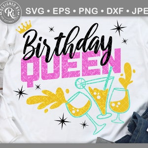 May include: A white t-shirt with the text "Birthday Queen" in pink glitter lettering. The design also includes a crown, stars, and a yellow and turquoise illustration of a cocktail glass.