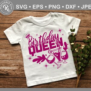 May include: White t-shirt with a pink design that says "Birthday Queen" with a crown and cocktail glasses.