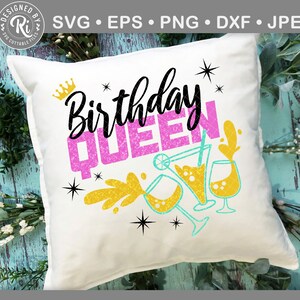 May include: White pillow with the text "Birthday Queen" in pink glitter lettering. The text is surrounded by gold glitter and blue and green cocktail glasses.