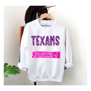 May include: White crewneck sweatshirt with the word "Texans" in purple, with a cursive "tarleton" underneath. A pink banner at the bottom reads "300 DPI PNG" and "NINE TWENTY FOUR DESIGNS". The sweatshirt is hanging on a wooden hanger.
