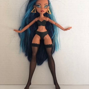 Leather lingerie will fit the petite curvy slimline doll. This is an 11 " doll. G3