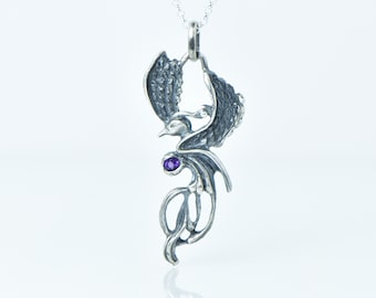 Silver phoenix pendant with amethyst gem
