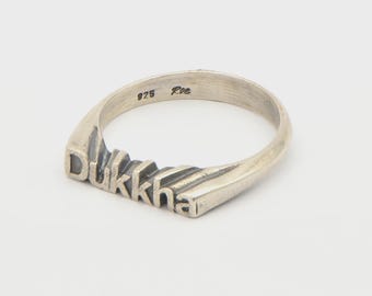 Sterling Silver Dukkha Ring – Sculpted Word Band with Seamless Flow
