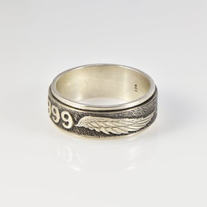 Angel number 999 spinning silver ring