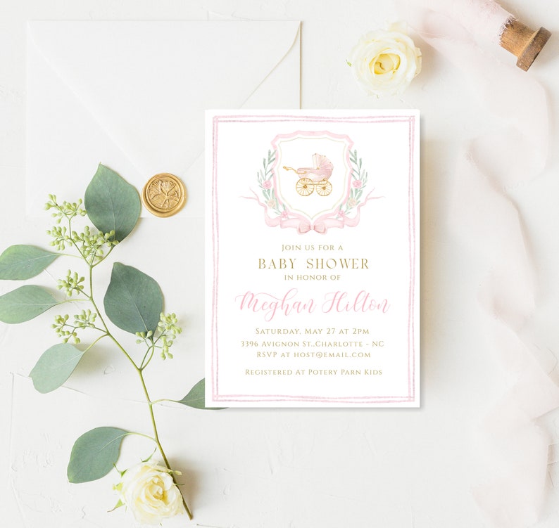 May include: Pink and gold baby shower invitation with a watercolor illustration of a carriage and a floral wreath. The invitation reads "Join us for a Baby Shower in honor of Meghan Hilton" and includes the date, time, address, RSVP information, and registry details.