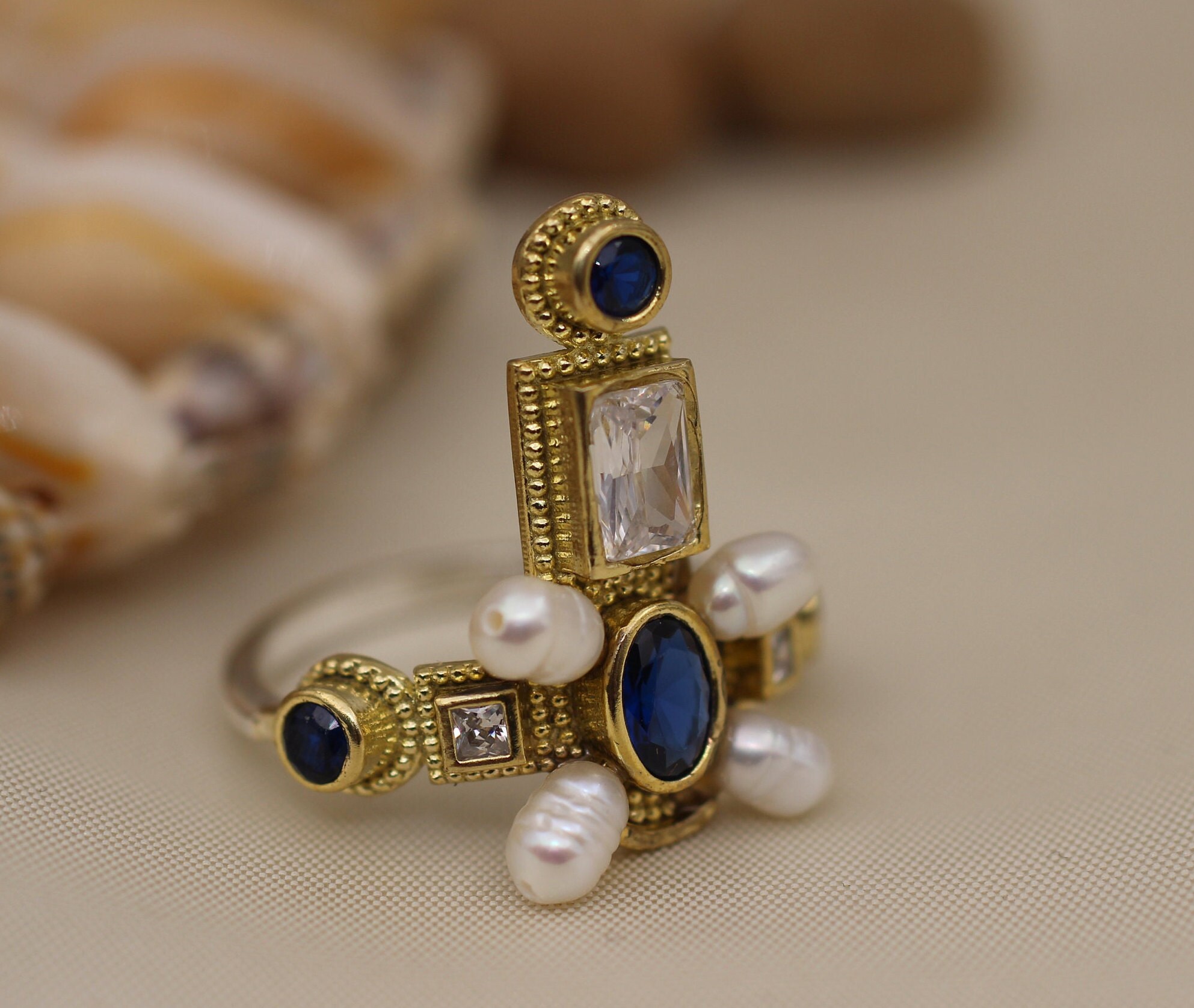 Sapphire cross ring deals