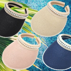 May include: Four straw visors with pearl trim in black, beige, pink, and blue.