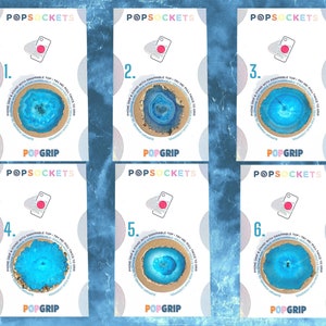 May include: Six different phone grips featuring a blue and gold agate design. Each grip displays the Popsocket logo and the text "PopGrip" and "PopSockets".
