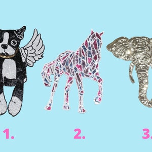 May include: Three sequined iron-on patches featuring a black and white Boston Terrier with wings, a pink and blue horse, and a silver elephant. The patches are numbered 1, 2, and 3.