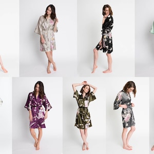 May include: Eight women wearing different floral patterned silk robes. The robes are in various colors, including teal, beige, black, mint green, purple, olive green, gray, and navy blue.