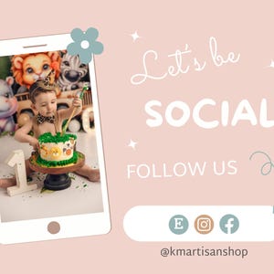 May include: A child wearing a safari-themed hat and holding a cake decorated with animal faces. The cake is on a wooden stand and the child is sitting on a green surface with sprinkles. The image is framed by a white phone screen with a blue flower in the top corner. The text "Let's be SOCIAL FOLLOW US" is on the right side of the image with social media icons and the text "@kmartanshop".