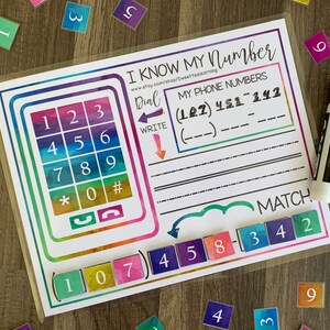 May include: A vibrant educational mat with the text "I Know My Number." It features a phone keypad, number matching, and a section to write phone numbers. Includes a dry-erase marker and number tiles for interactive learning.