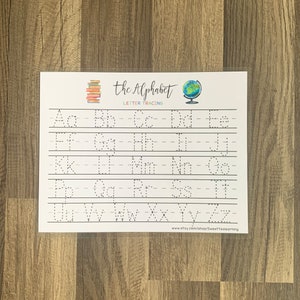 May include: A white alphabet tracing worksheet with the words "the Alphabet Letter Tracing" at the top. The worksheet features dotted letters for tracing, from A to Z, in both uppercase and lowercase. A stack of books and a globe are also featured.