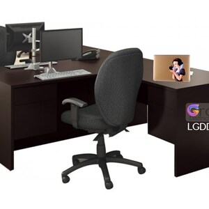 May include: A dark brown L-shaped desk with a black office chair, two computer monitors, a keyboard, and a laptop with a Snow White sticker on the lid. The desk has a drawer and the text "Grafer Distinct Decor" and "LGDD2134" are printed on the desk.