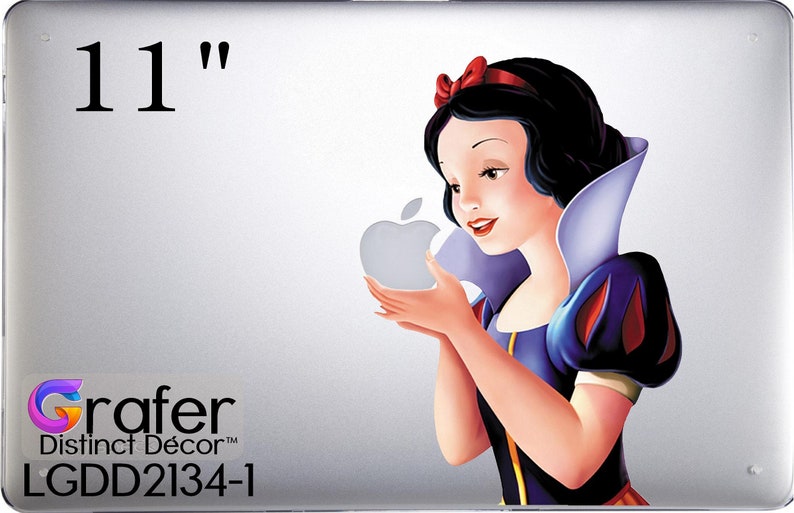 May include: A 11" laptop skin featuring a colorful illustration of Snow White holding a red apple. The skin is designed by Grafer Distinct D&eacute;cor and has the product code LGDD2134-1.