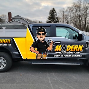 May include: A gray pickup truck with a yellow and black graphic. The graphic includes the text "DECK & PATIO EXPERTS" and "MODERN DREAM SERVICES". A cartoon image of a man holding a hammer is on the side. The phone number 774-408-0582 is also visible.