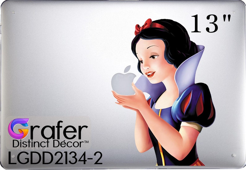 May include: A 13-inch laptop skin featuring Snow White holding a red apple. The skin has a white background with a black and white Apple logo. The skin also has the text "Grafer Distinct D&eacute;cor&trade; LGDD2134-2" in black text.