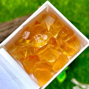 May include: A set of three ceramic mugs with a speckled, matte finish. Each mug features a different color: light blue, cream, and gray. The mugs have a simple, modern design and a comfortable handle.