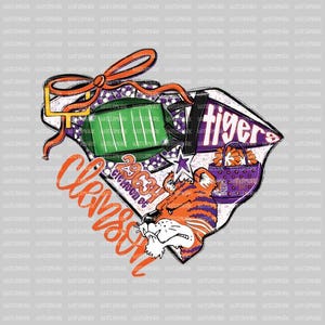 May include: A Clemson Tigers-themed graphic with a football field, a tiger head, and the word "Clemson" in orange script. The design includes a football, a star, and the text "2023 Season". A banner reads "tiger".